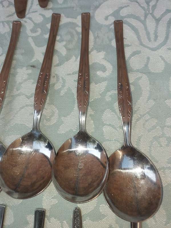 A 34-PIECE ALFA STAINLESS STEEL CUTLERY SET
