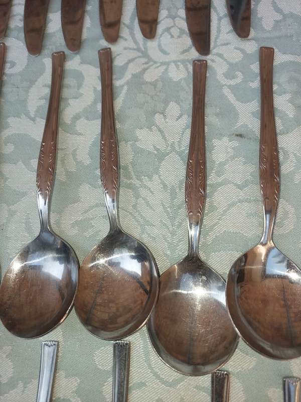 A 34-PIECE ALFA STAINLESS STEEL CUTLERY SET