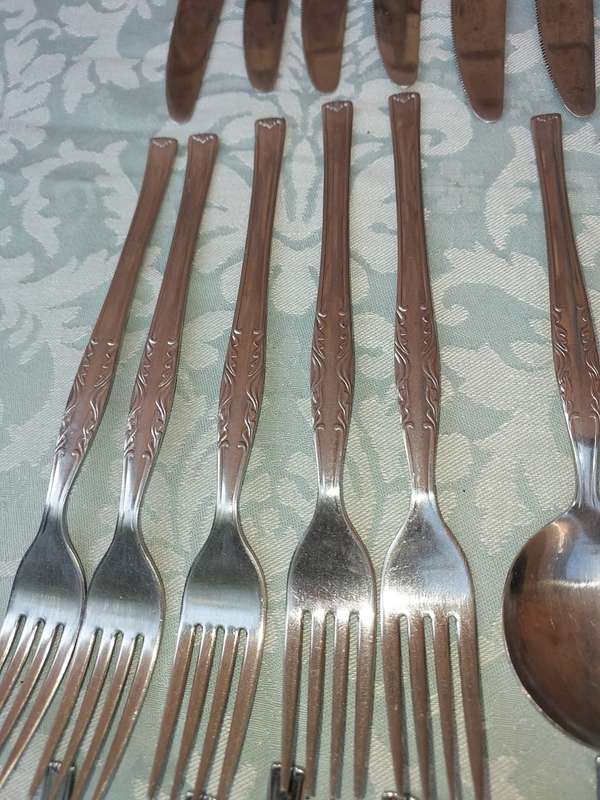 A 34-PIECE ALFA STAINLESS STEEL CUTLERY SET