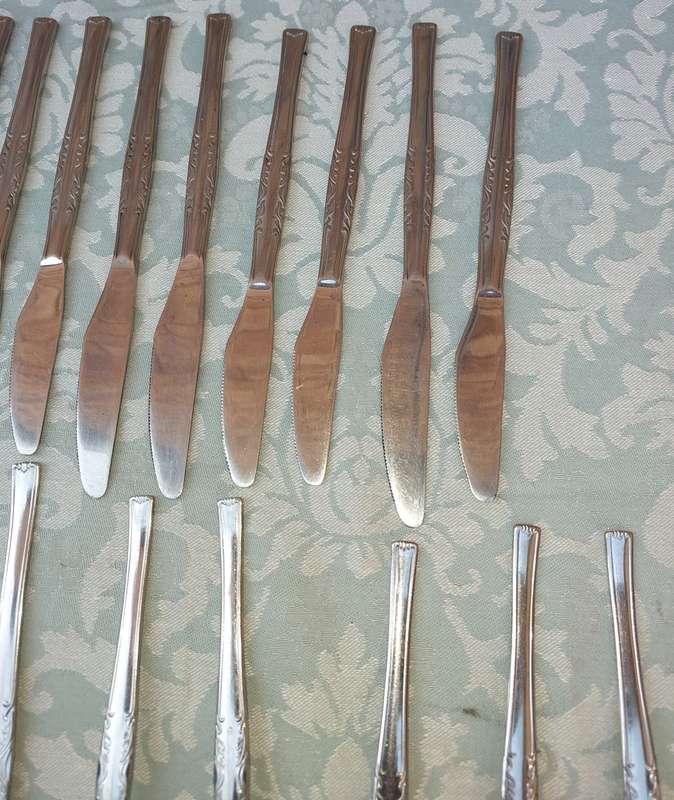 A 34-PIECE ALFA STAINLESS STEEL CUTLERY SET
