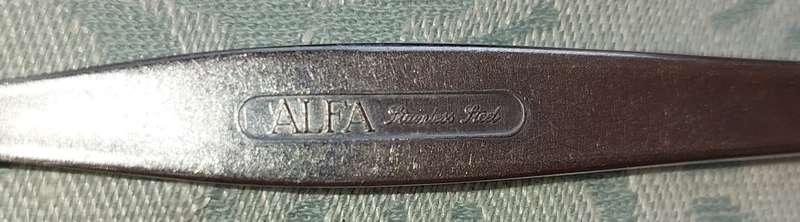 A 34-PIECE ALFA STAINLESS STEEL CUTLERY SET