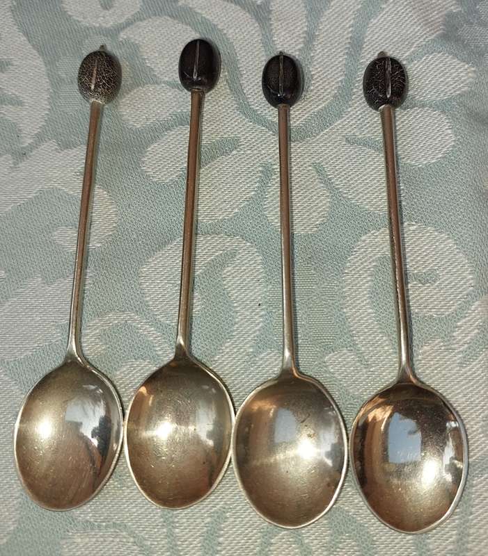 A VINTAGE SET OF COFFEE BEAN TEASPOONS SOLD AS IS