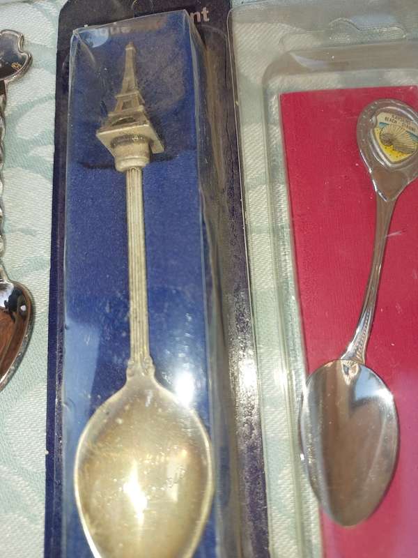 A COLLECTION OF MEMORABILIA SPOONS
