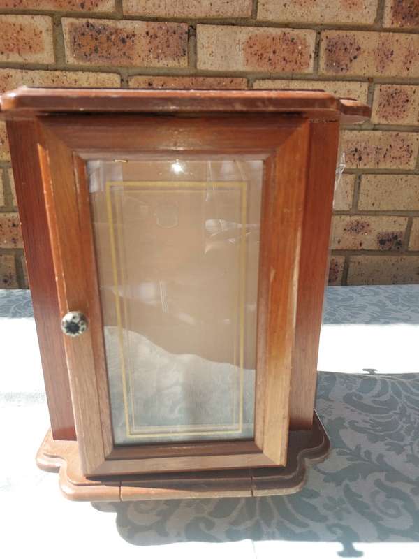 AN ELEGANT WOODEN JEWELRY BOX STAND ON A SWIVEL BASE AND DRAWERS SOLD AS