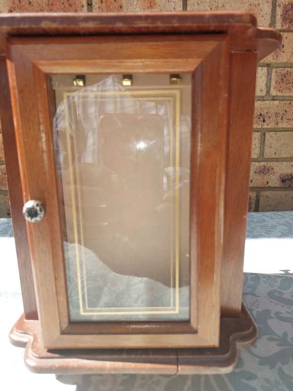 AN ELEGANT WOODEN JEWELRY BOX STAND ON A SWIVEL BASE AND DRAWERS SOLD AS