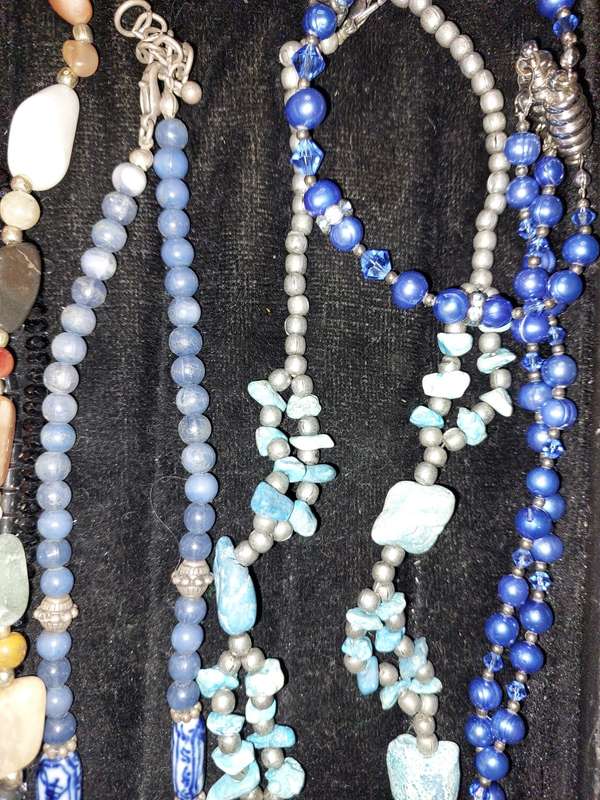 A COLLECTION OF DESIGNER COSTUME NECKLACES USED SOLD AS IS