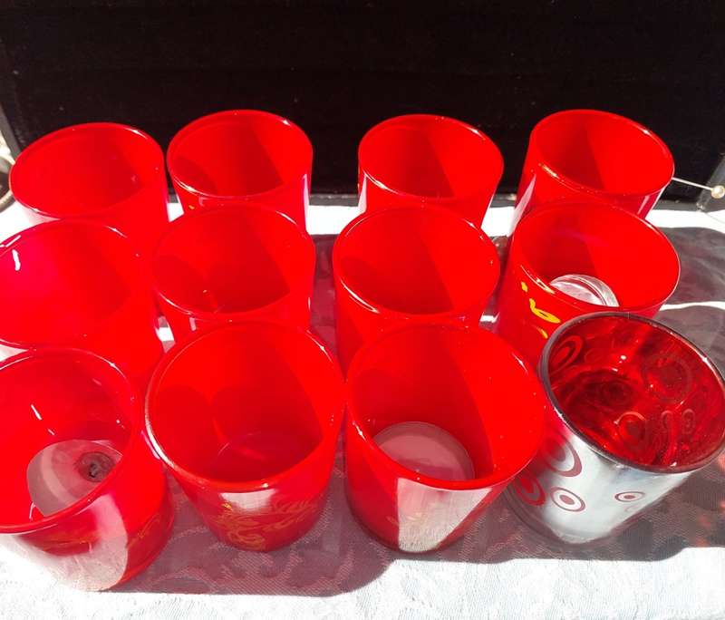 A COLLECTION OF 12 RED CANDLE HOLDER GLASSES