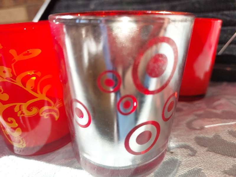 A COLLECTION OF 12 RED CANDLE HOLDER GLASSES