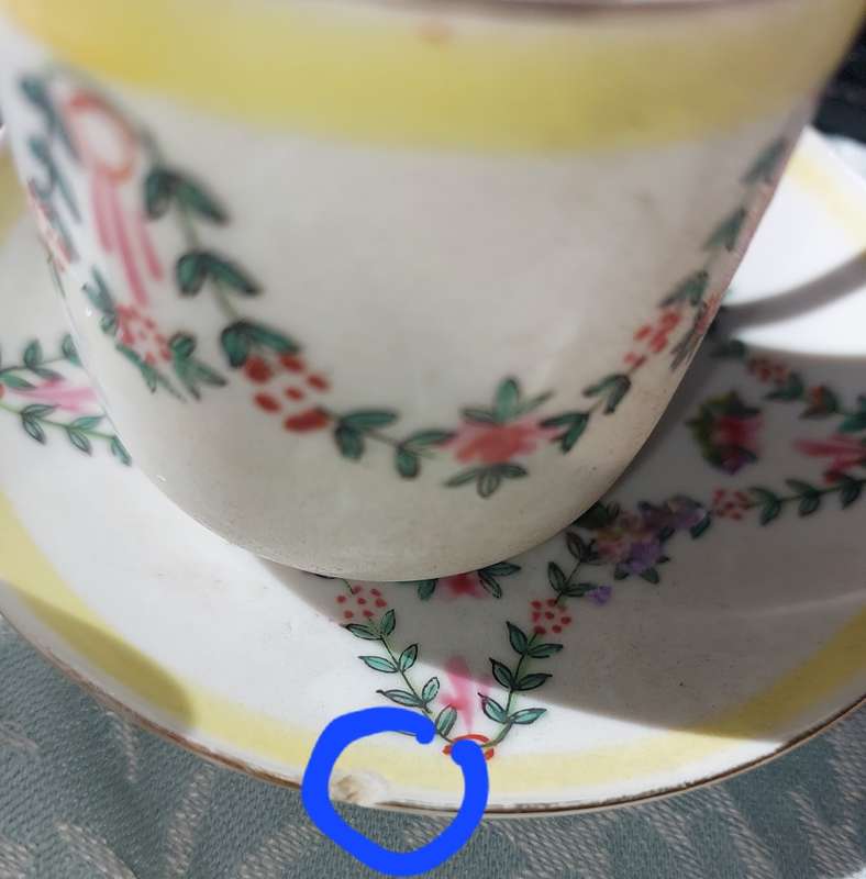 A COLLECTION OF HAND PAINTED TEA CUPS AND SAUCERS