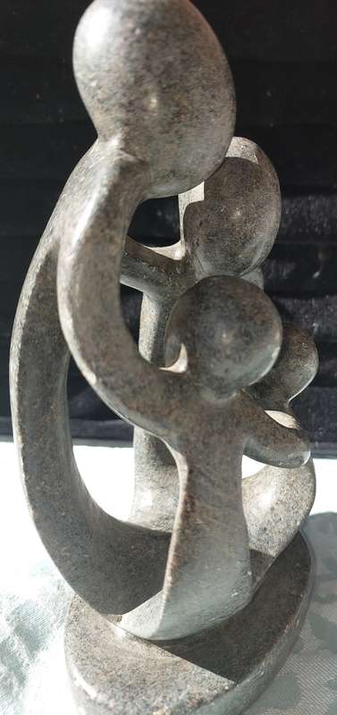 A GRANITE SHONA FAMILY OF 4 SCULPTURE