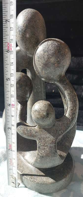 A GRANITE SHONA FAMILY OF 4 SCULPTURE
