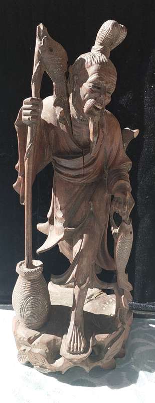AN ANTIQUE CHINESE CARP FISHERMAN STATUE
