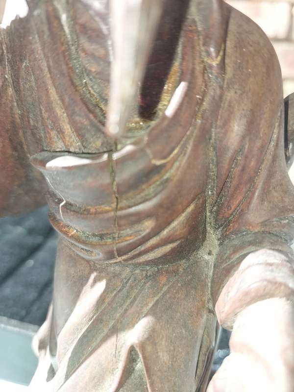 AN ANTIQUE CHINESE CARP FISHERMAN STATUE