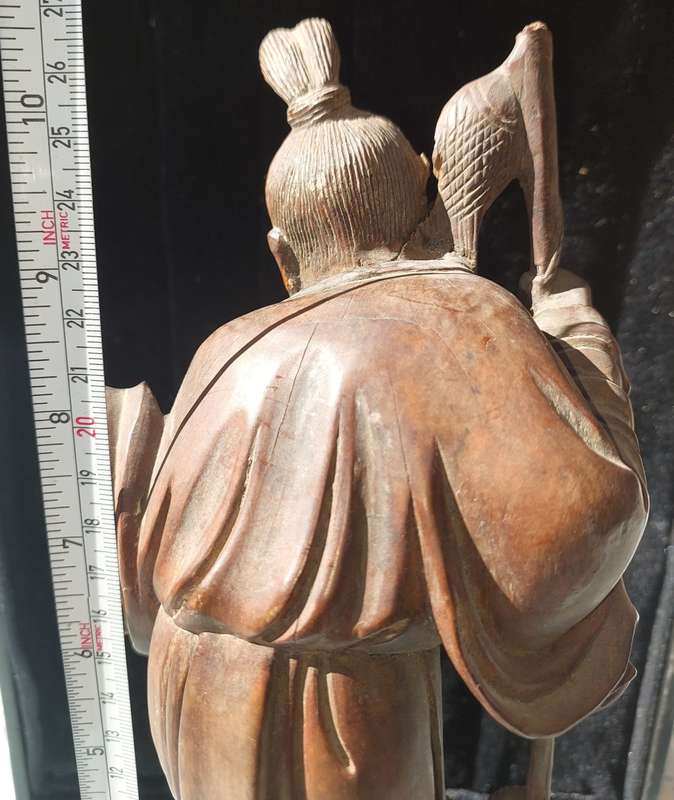 AN ANTIQUE CHINESE CARP FISHERMAN STATUE