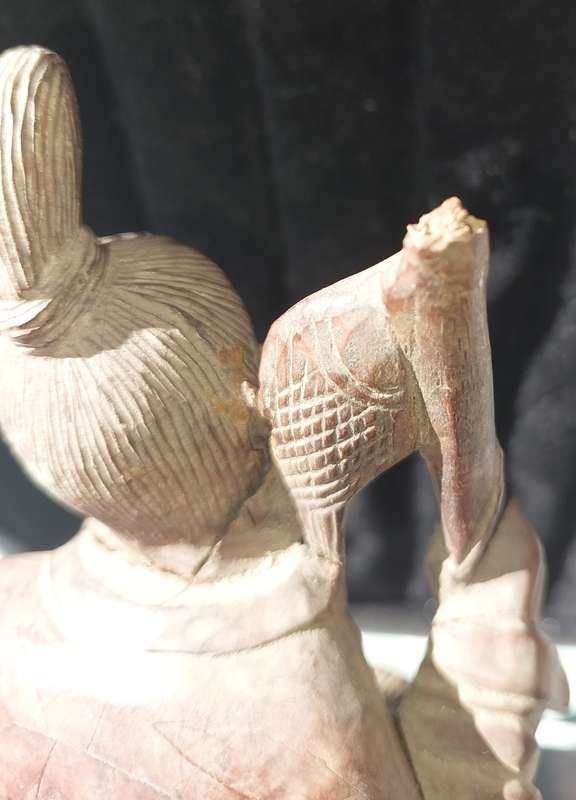 AN ANTIQUE CHINESE CARP FISHERMAN STATUE