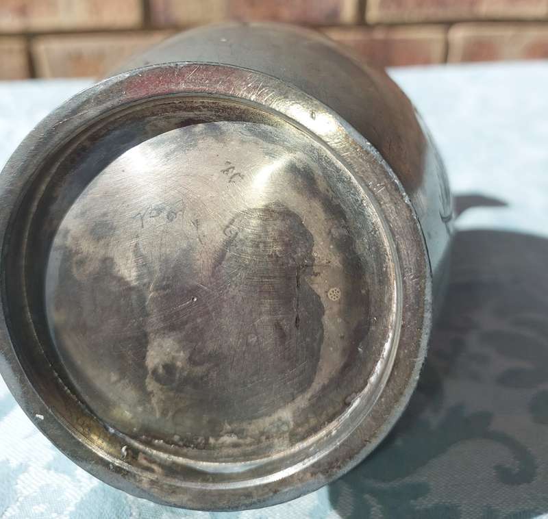 A VINTAGE PUTHAL SILVER PLATED JUG WITH ORNATE ENGRAVINGS