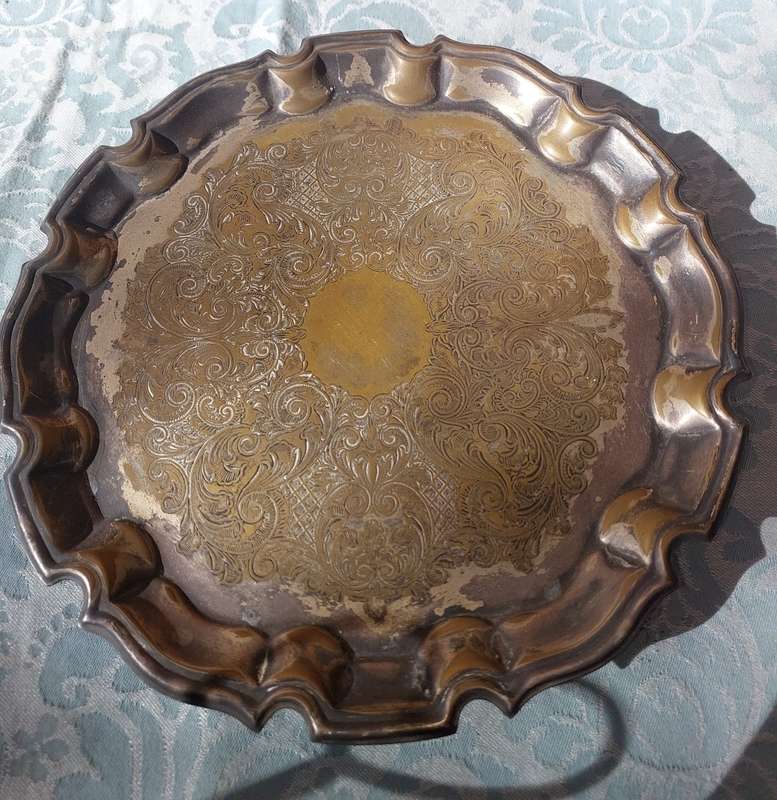A 27 CENTIMETER DIAMETER VICTORIAN EPNS SERVING TRAY