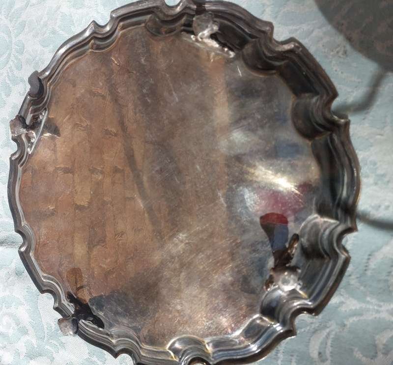 A 27 CENTIMETER DIAMETER VICTORIAN EPNS SERVING TRAY