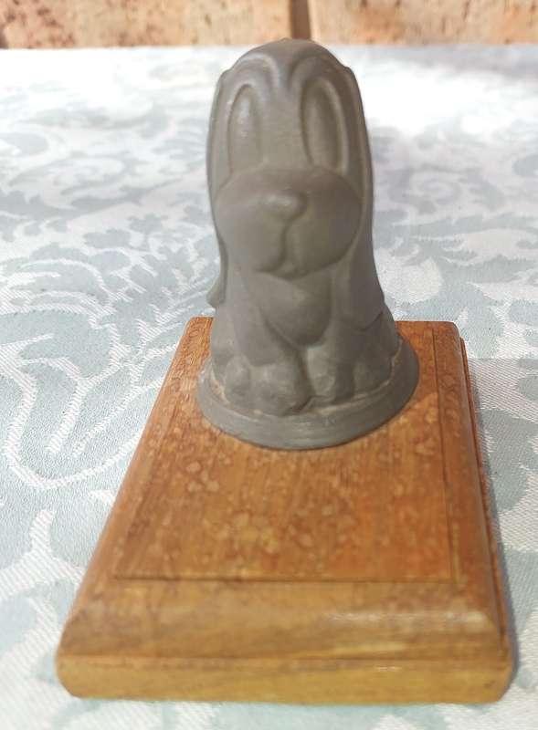 A HEAVY BASSET DOG  CAST IRON PAPERWEIGHT WITH A PINE BASE