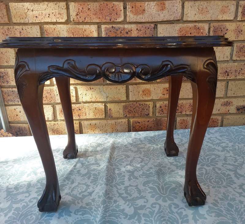 AN ANTIQUE RECTANGULAR SOLID WOOD BALL N CLAW LEGGED OCCASIONAL TABLE