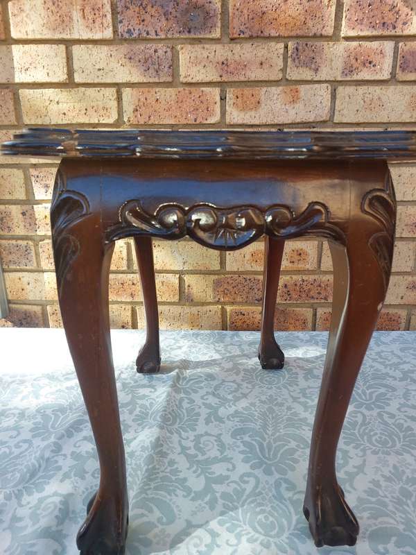 AN ANTIQUE RECTANGULAR SOLID WOOD BALL N CLAW LEGGED OCCASIONAL TABLE