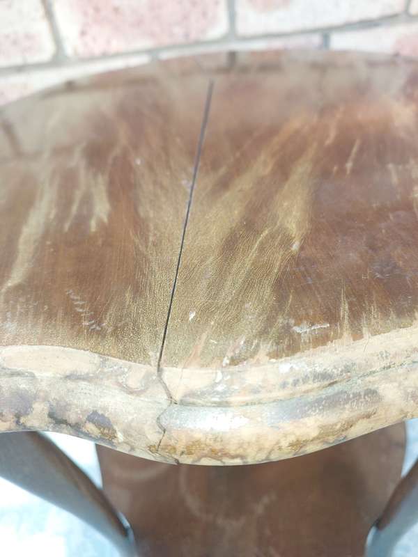 AN ANTIQUE SOLID WOOD TWO TEAR TEA TABLE WITH BALL N CLAW LEGS