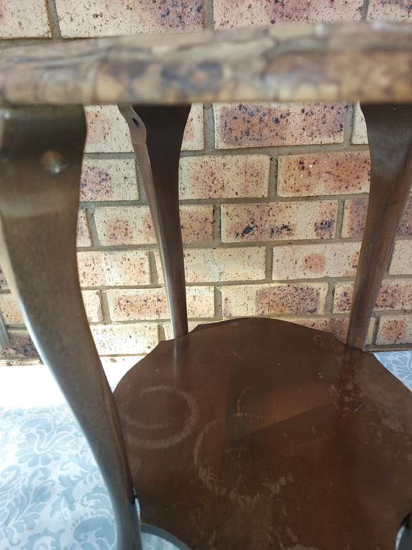 AN ANTIQUE SOLID WOOD TWO TEAR TEA TABLE WITH BALL N CLAW LEGS