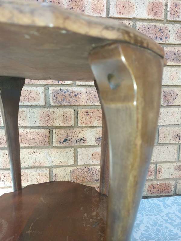AN ANTIQUE SOLID WOOD TWO TEAR TEA TABLE WITH BALL N CLAW LEGS