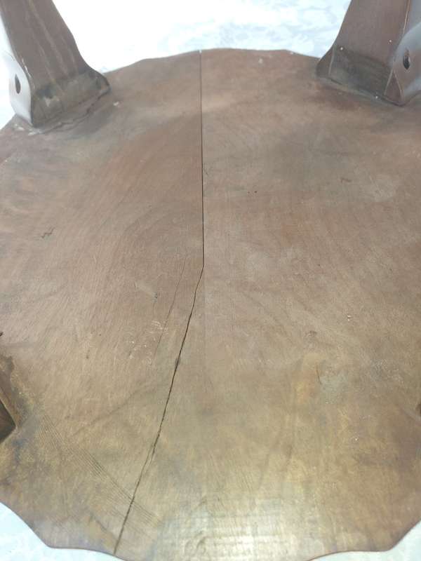 AN ANTIQUE SOLID WOOD TWO TEAR TEA TABLE WITH BALL N CLAW LEGS