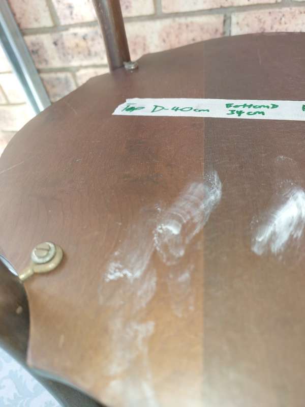 AN ANTIQUE SOLID WOOD TWO TEAR TEA TABLE WITH BALL N CLAW LEGS