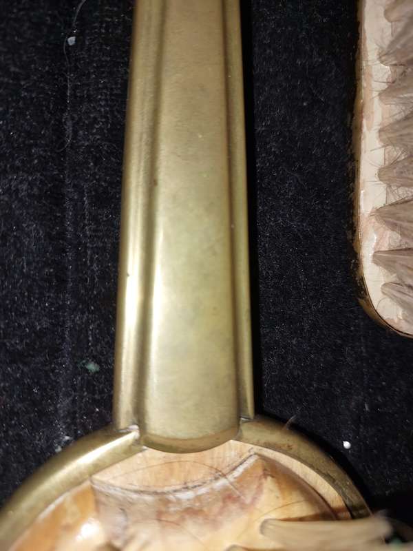 AN ANTIQUE COLLECTION EDWARDIAN BRASS GOLD PLATED HAIR BRUSHES