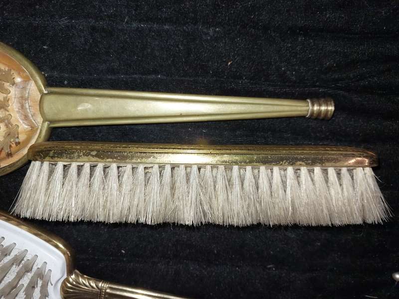 AN ANTIQUE COLLECTION EDWARDIAN BRASS GOLD PLATED HAIR BRUSHES
