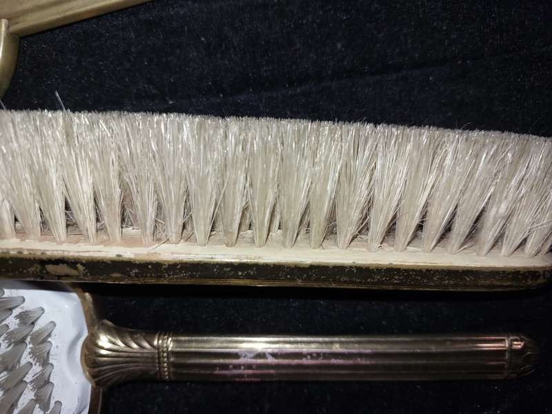 AN ANTIQUE COLLECTION EDWARDIAN BRASS GOLD PLATED HAIR BRUSHES