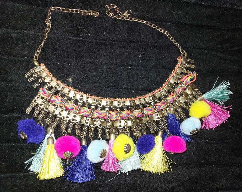 AN ETHNIC BRASS COLLAR NECKLACE SOLD AS IS