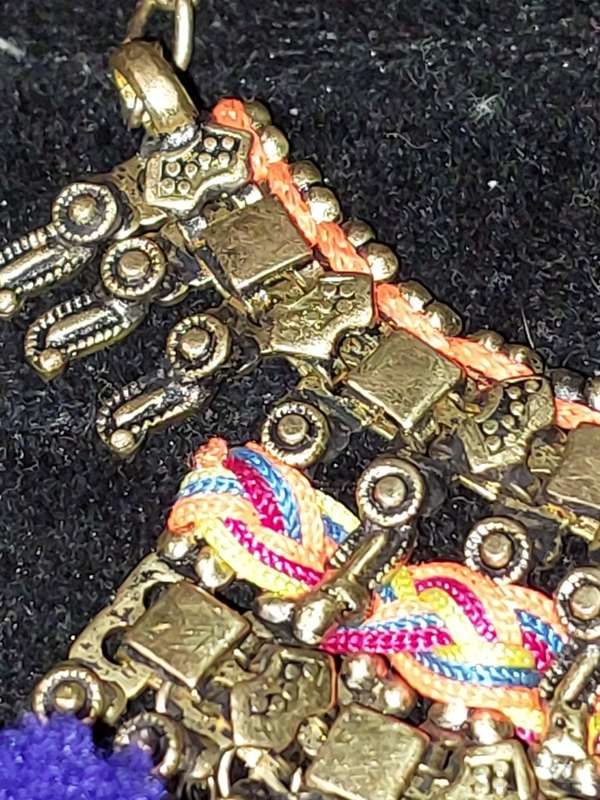 AN ETHNIC BRASS COLLAR NECKLACE SOLD AS IS