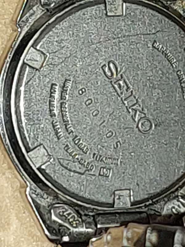 A VINTAGE SEIKO LADYS SAFFIRE CRYSTAL DATE  TITANIUM