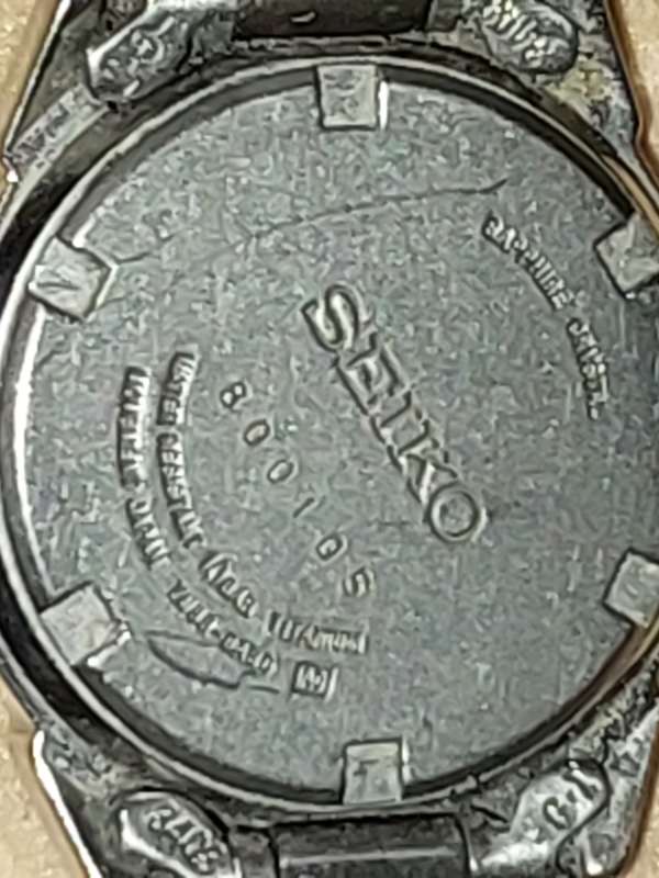 A VINTAGE SEIKO LADYS SAFFIRE CRYSTAL DATE  TITANIUM