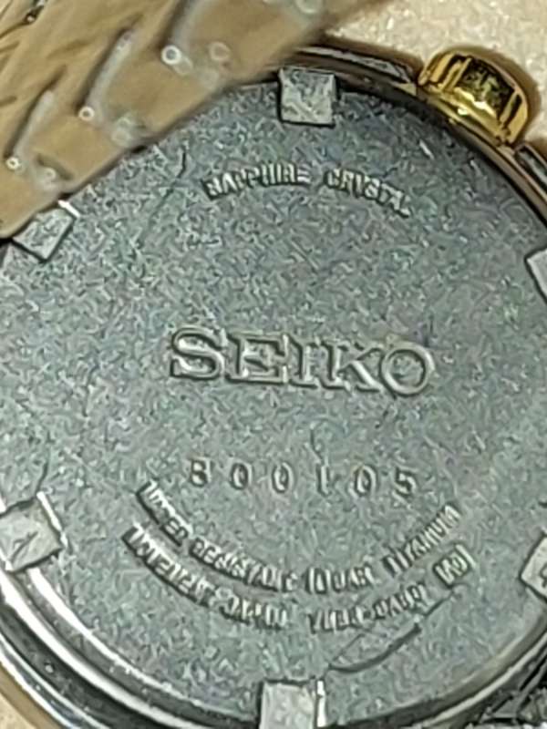 A VINTAGE SEIKO LADYS SAFFIRE CRYSTAL DATE  TITANIUM