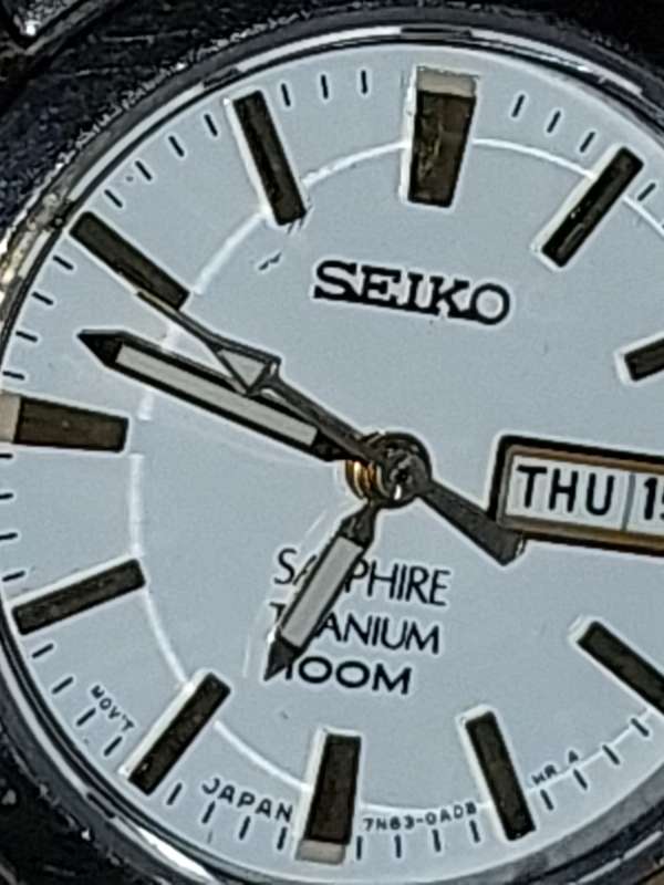 A VINTAGE SEIKO LADYS SAFFIRE CRYSTAL DATE  TITANIUM