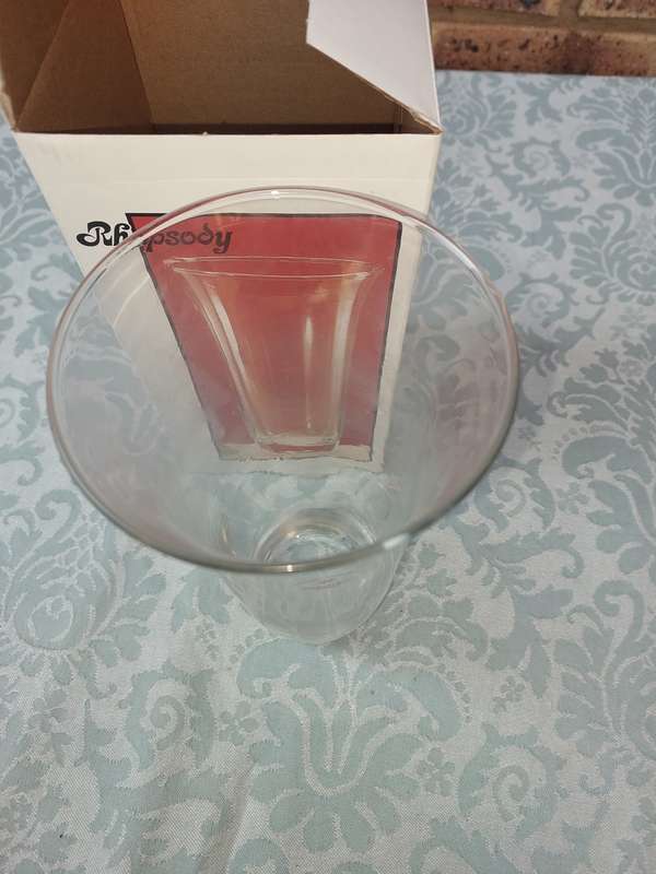 A RHAPSODY GLASS VASE SOLD AS IS