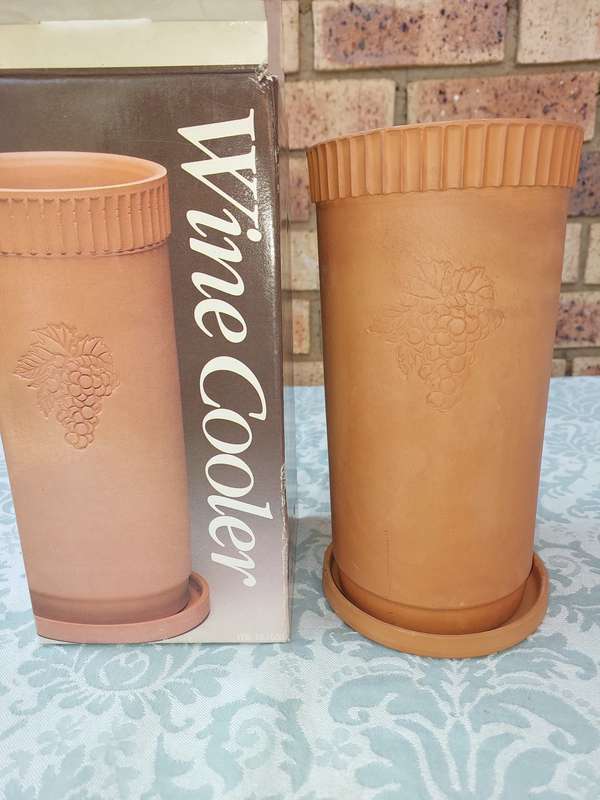 A VINTAGE TERRACOTTA WINE COOLER SOLD AS IS