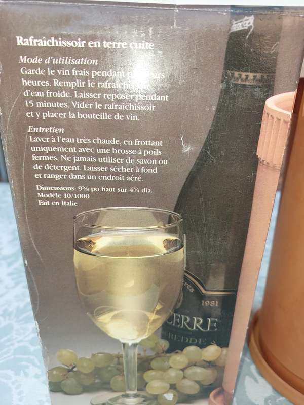 A VINTAGE TERRACOTTA WINE COOLER SOLD AS IS