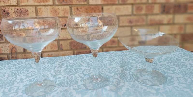 A COLLECTION OF  EXTRA LARGE GLASS SWEATS STANDS SOLD AS IS