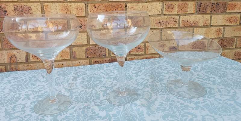 A COLLECTION OF  EXTRA LARGE GLASS SWEATS STANDS SOLD AS IS