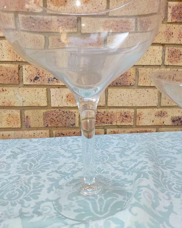 A COLLECTION OF  EXTRA LARGE GLASS SWEATS STANDS SOLD AS IS