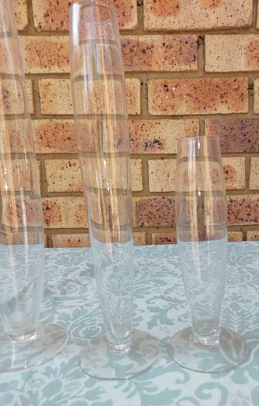 A COLLECTION OF THREE ART DECOR FLUTED GLASS VASES
