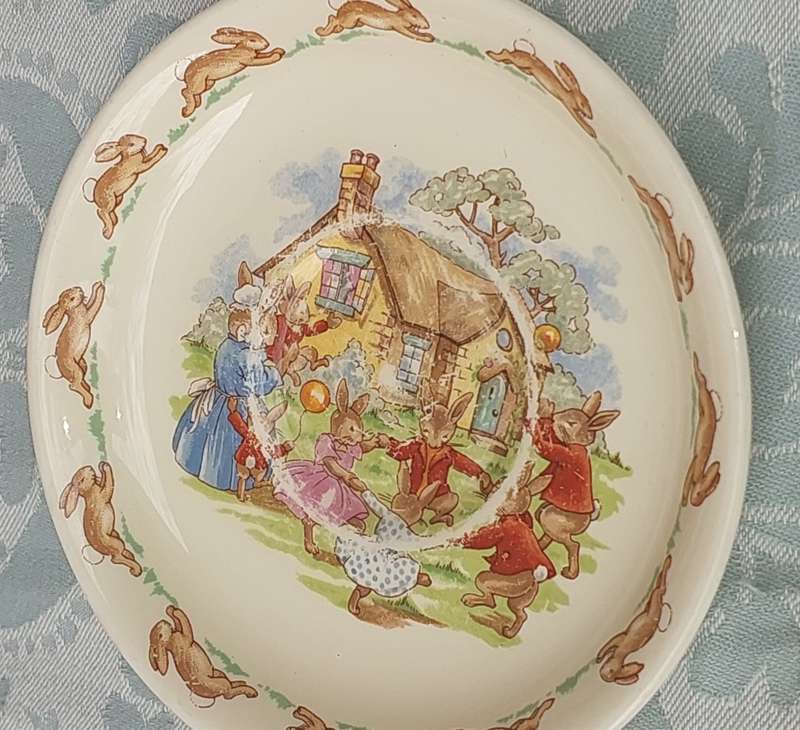 A RARE ROYAL DOULTON BUNNYKINS TEA CUP AND SAUCER