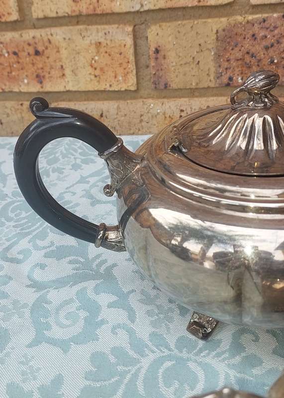 AN ANTIQUE TEA JUG SET SOLD AS IS