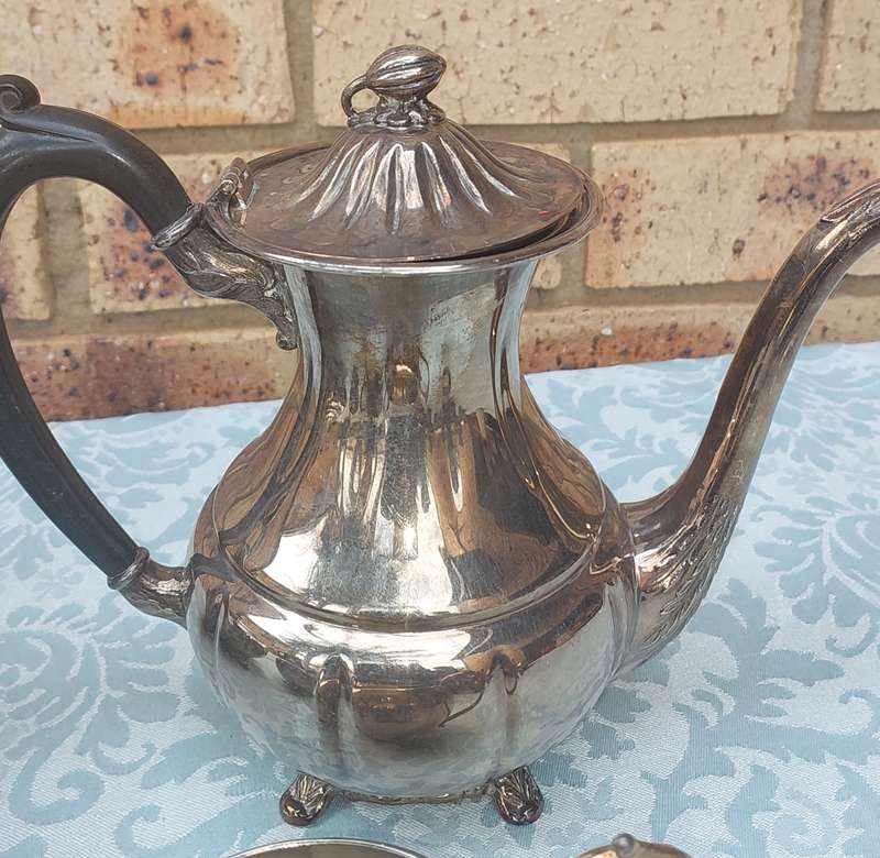 AN ANTIQUE TEA JUG SET SOLD AS IS