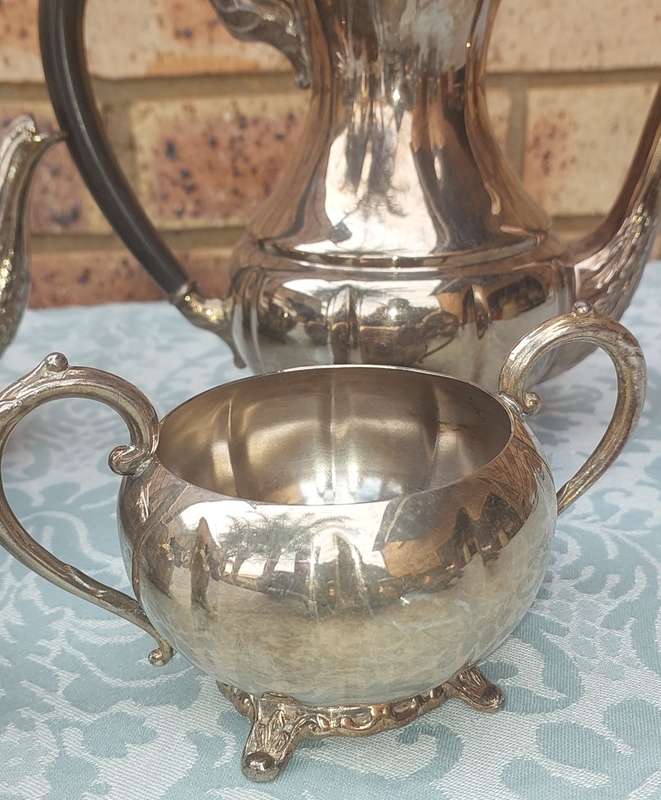 AN ANTIQUE TEA JUG SET SOLD AS IS